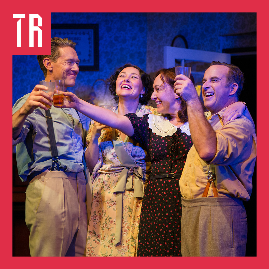 Image: Chris Parker Four audults, two mena nd two women, dressed in 1950's Australiana fashion, smile in a friendly embrace, cheersing drinks